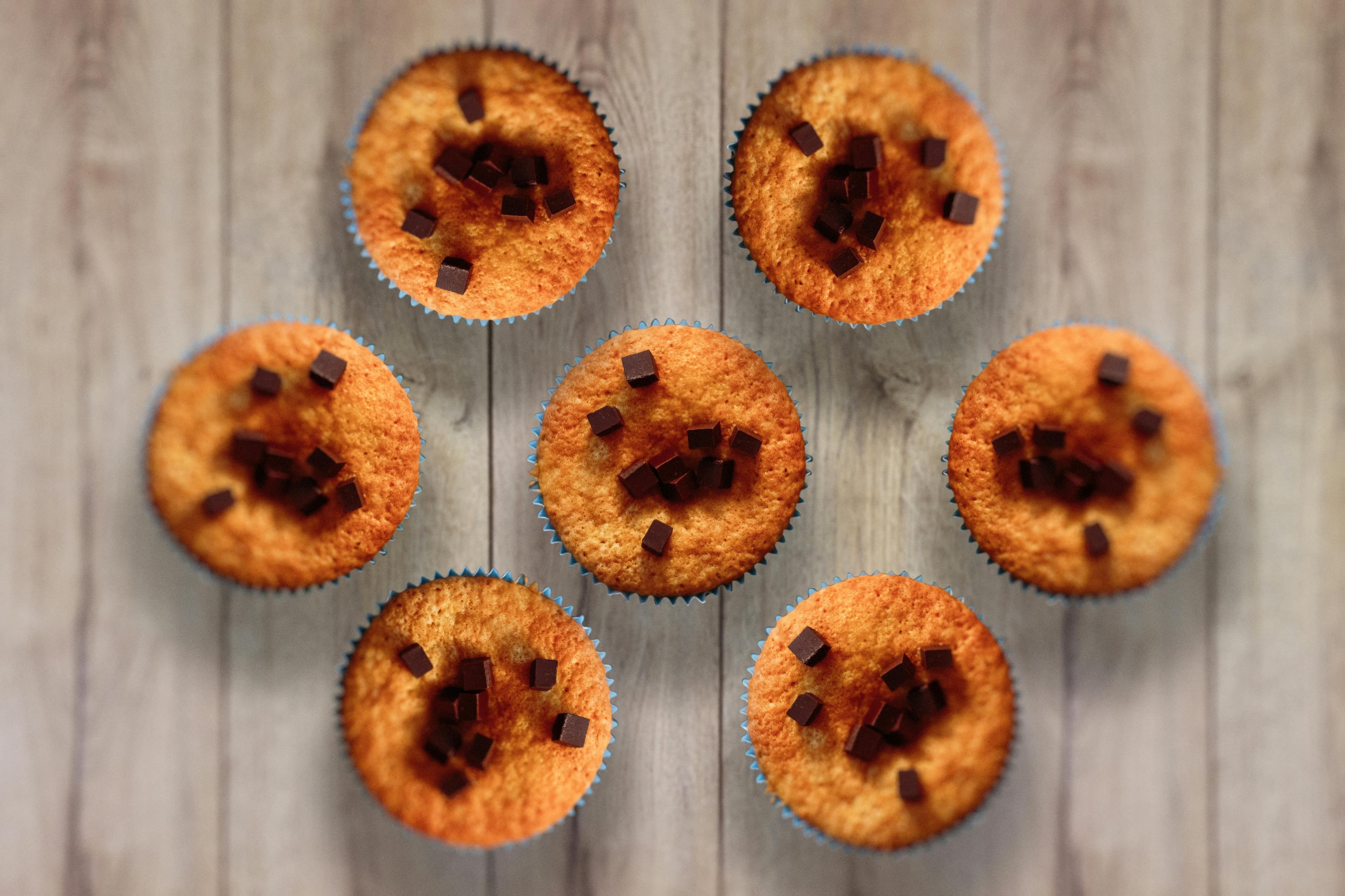 Woman comparing AI calorie counting apps on phone and tablet